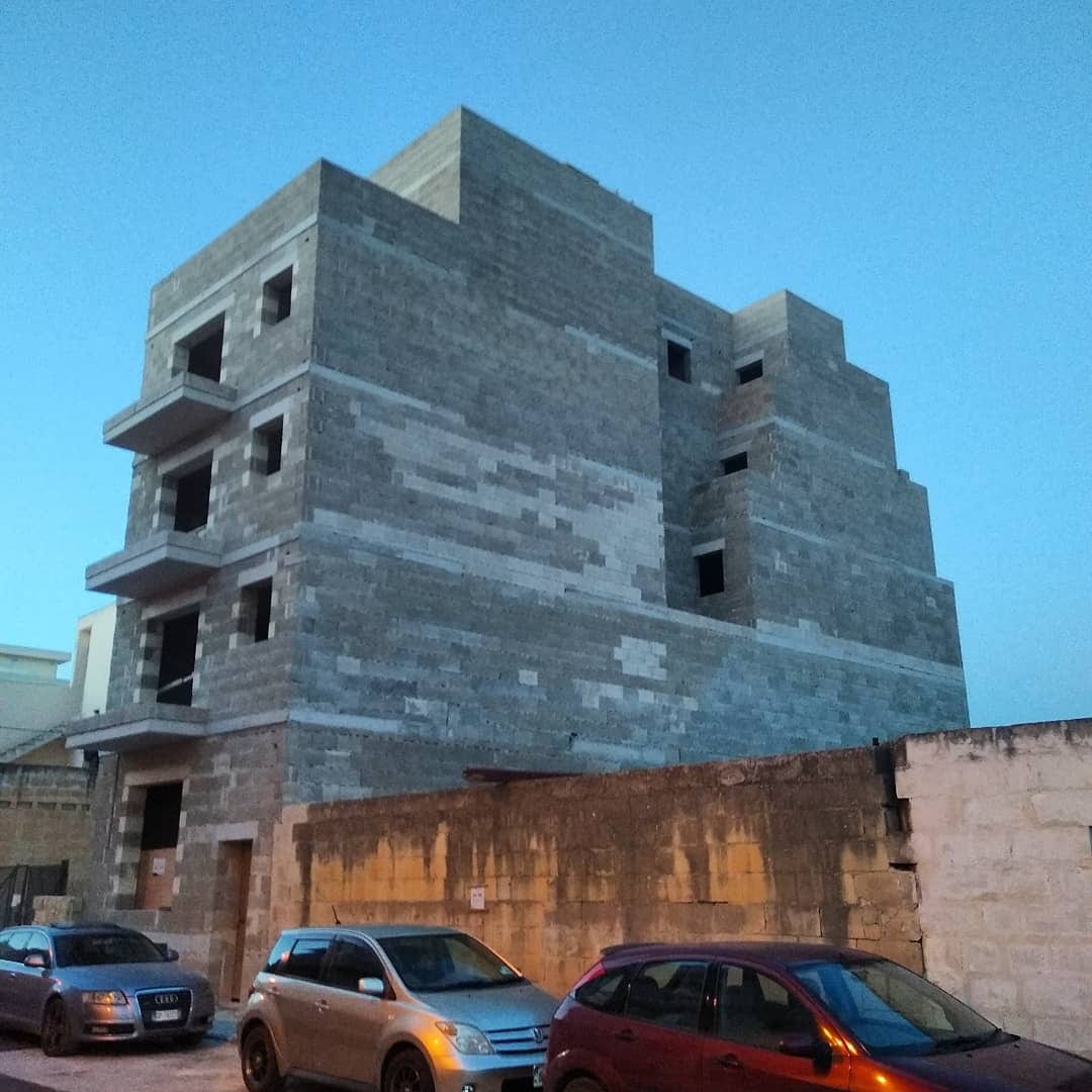 A blank stone-clad modern block