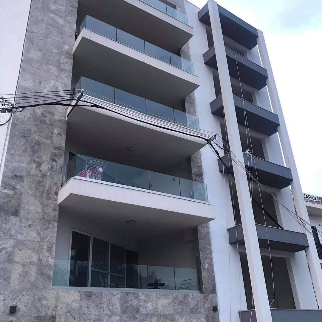 Stacked concrete balconies of an apartment block