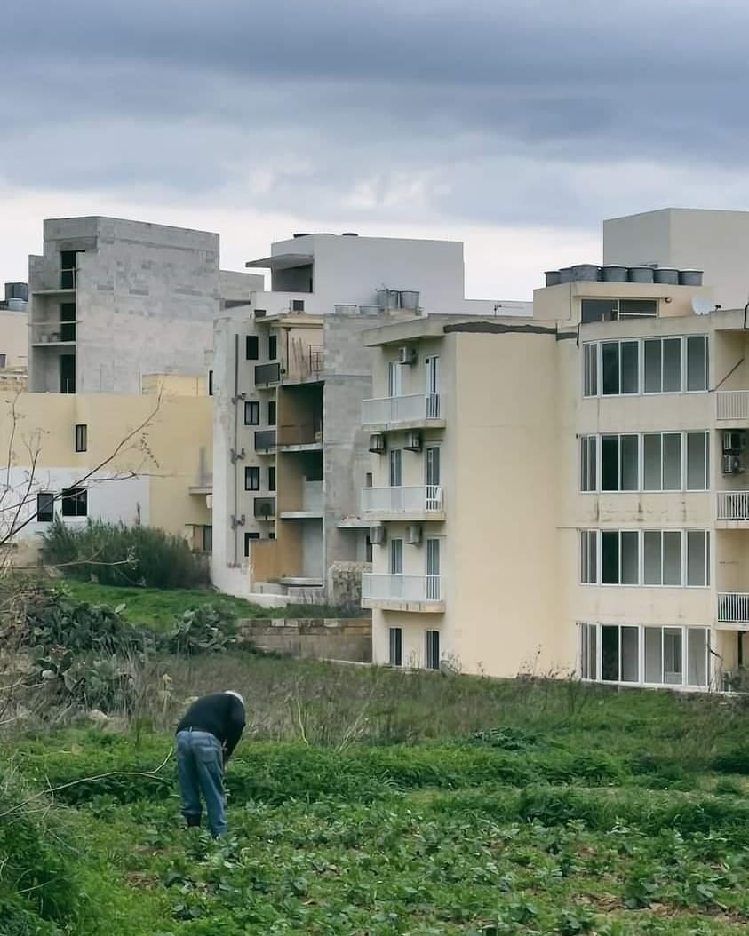 Apartment blocks on a parched hillside