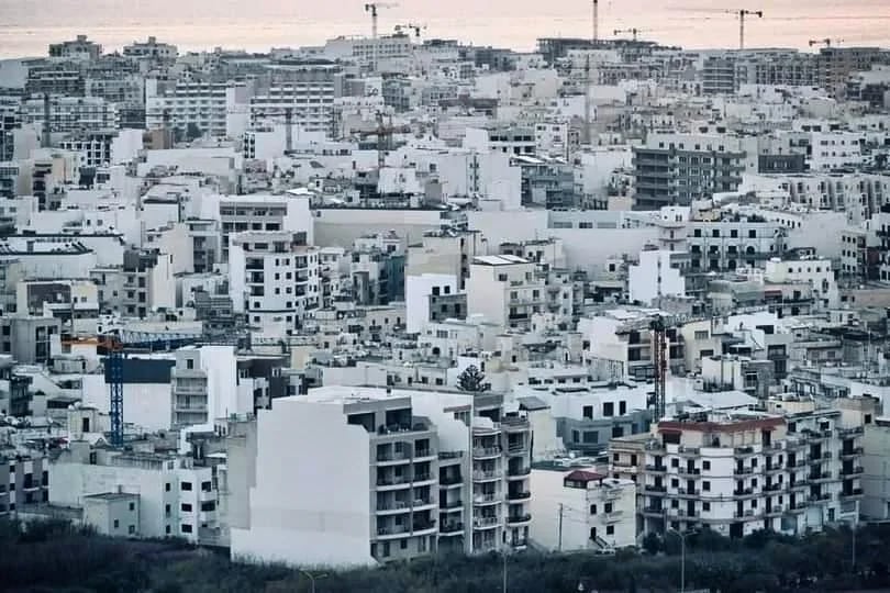Greyscale aerial of dense Maltese development