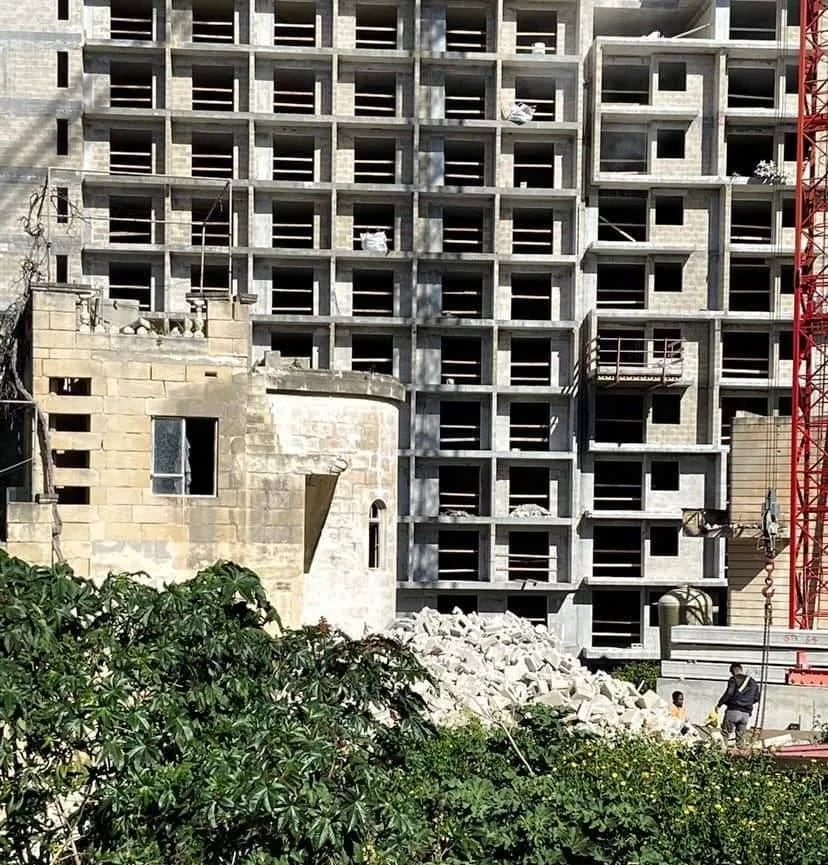 A concrete tower rising on a hillside